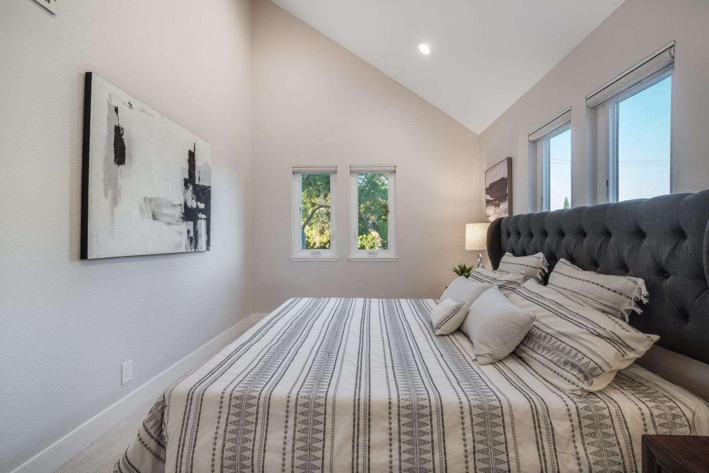 181 Centre Street, Unit 1 Mountain View, CA 94041 - Photo 17 of 58 a bedroom with a large bed and a couch