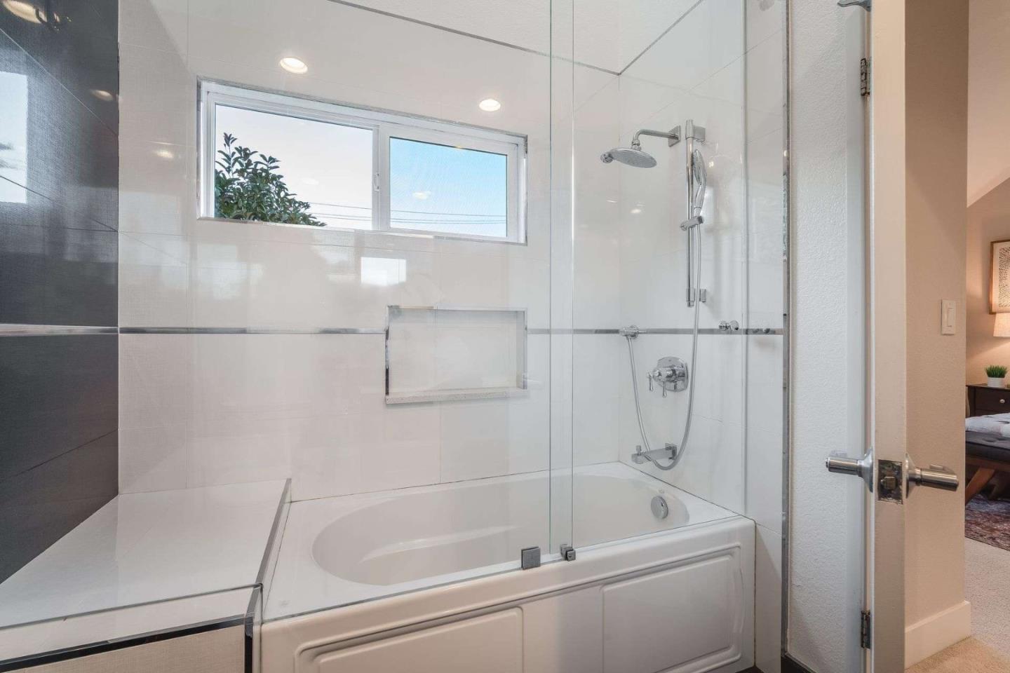 181 Centre Street, Unit 1 Mountain View, CA 94041 - Photo 28 of 58 a bathroom with a tub a mirror and a shower