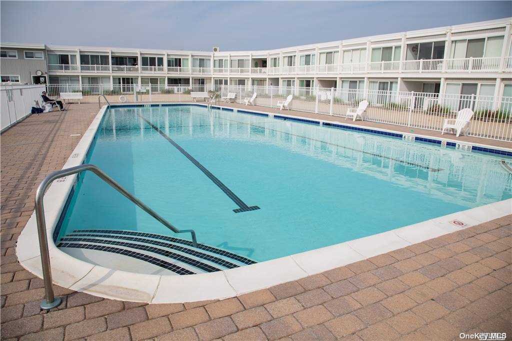 a view of swimming pool with a back yard