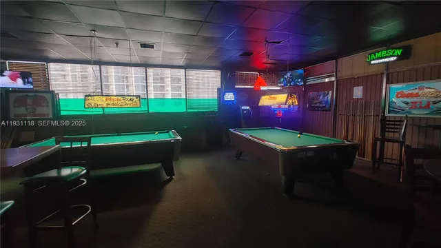 a view of a chairs and tables in a patio