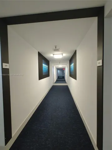 a view of a hallway with an empty room