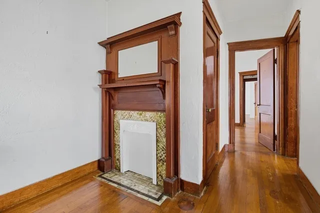 a view of front door with wooden floor