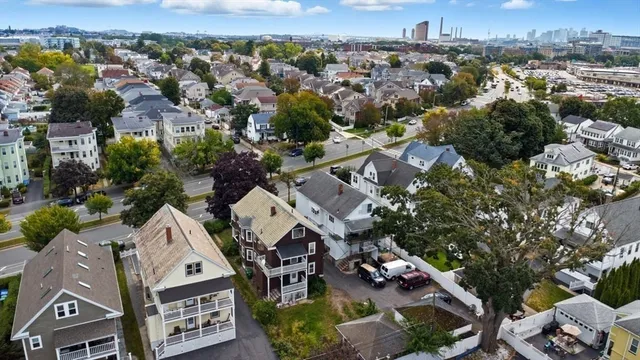 an aerial view of residential houses with outdoor space