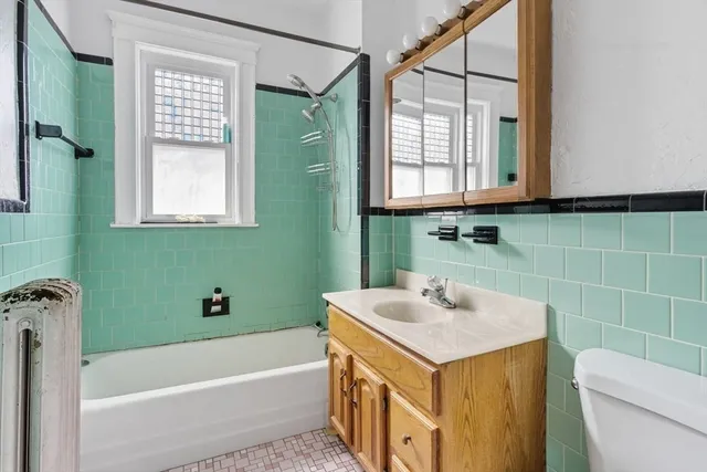 a bathroom with a sink a toilet and a bathtub