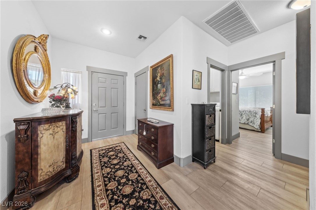 550 Kings Links Street Henderson, NV 89012 - Photo 5 of 36 Hall featuring light wood-type flooring and baseboards