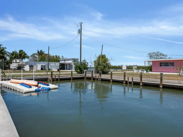 a view of swimming pool with outdoor seating