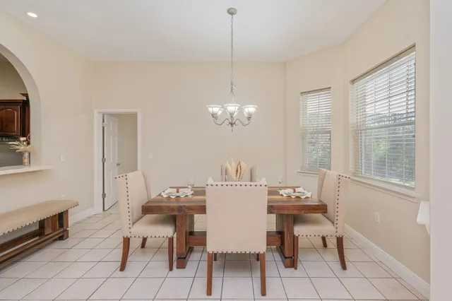 a view of a dining room with furniture window and outside view