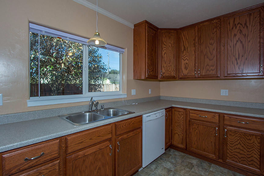1732 Ash Street Fortuna, CA 95540 - Photo 9 of 37 a kitchen with a sink cabinets and window