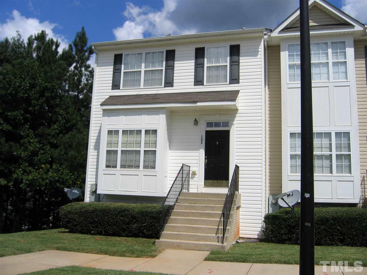 2840 Barrymore Street, Unit 105 Raleigh, NC 27603 - Photo 1 of 9 a front view of a house with a yard