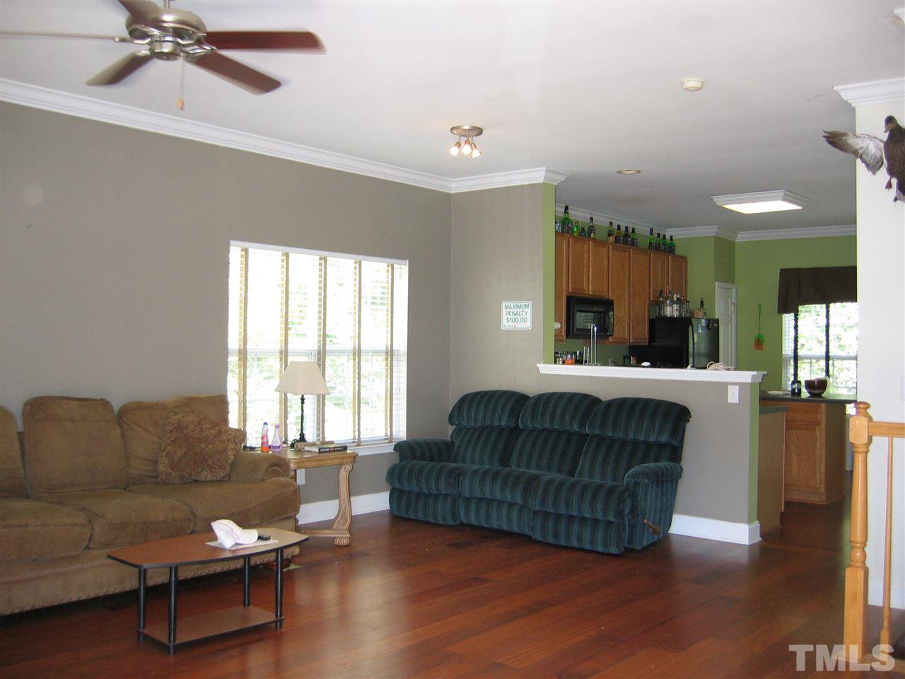 2840 Barrymore Street, Unit 105 Raleigh, NC 27603 - Photo 2 of 9 a living room with furniture and a large window