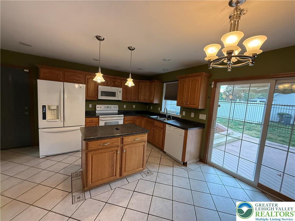 114 Kestrel Road Mountain Top, PA 18707 - Photo 14 of 45 a kitchen with stainless steel appliances granite countertop a stove a sink a counter space and cabinets