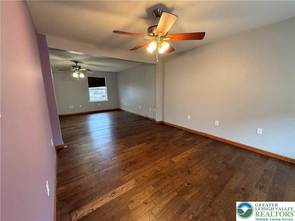 114 Kestrel Road Mountain Top, PA 18707 - Photo 19 of 45 wooden floor in an empty room with a chandelier