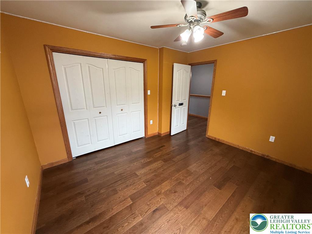 114 Kestrel Road Mountain Top, PA 18707 - Photo 28 of 45 a view of an empty room with wooden floor and a ceiling fan