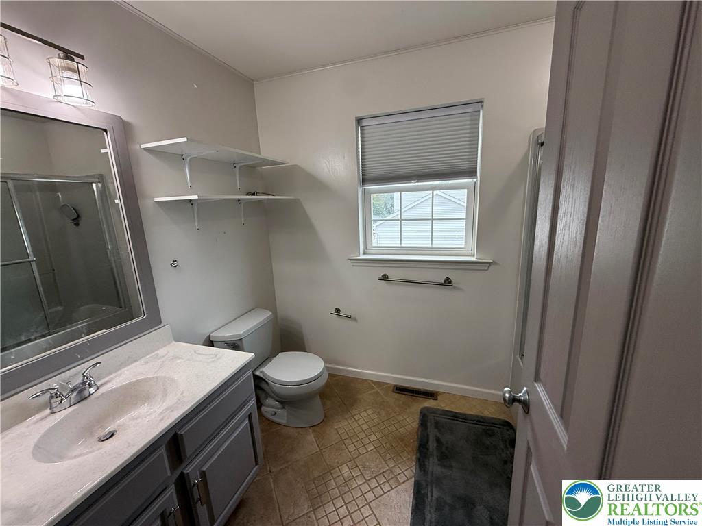 114 Kestrel Road Mountain Top, PA 18707 - Photo 36 of 45 a bathroom with a sink a toilet a mirror and shower