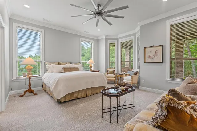 a bedroom with a bed and a couch