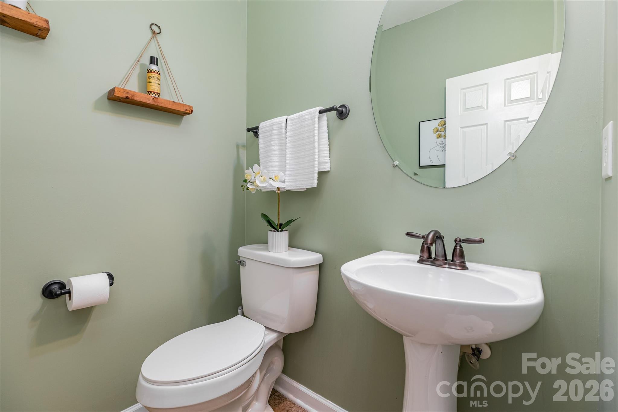 353 Chorus Road Fort Mill, SC 29715 - Photo 18 of 30 a bathroom with a toilet sink and mirror