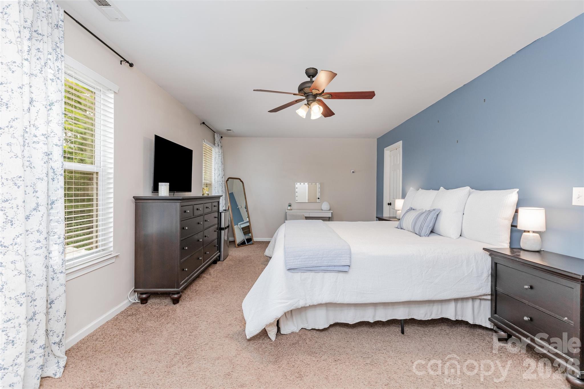 353 Chorus Road Fort Mill, SC 29715 - Photo 21 of 30 a spacious bedroom with a bed and a flat screen tv