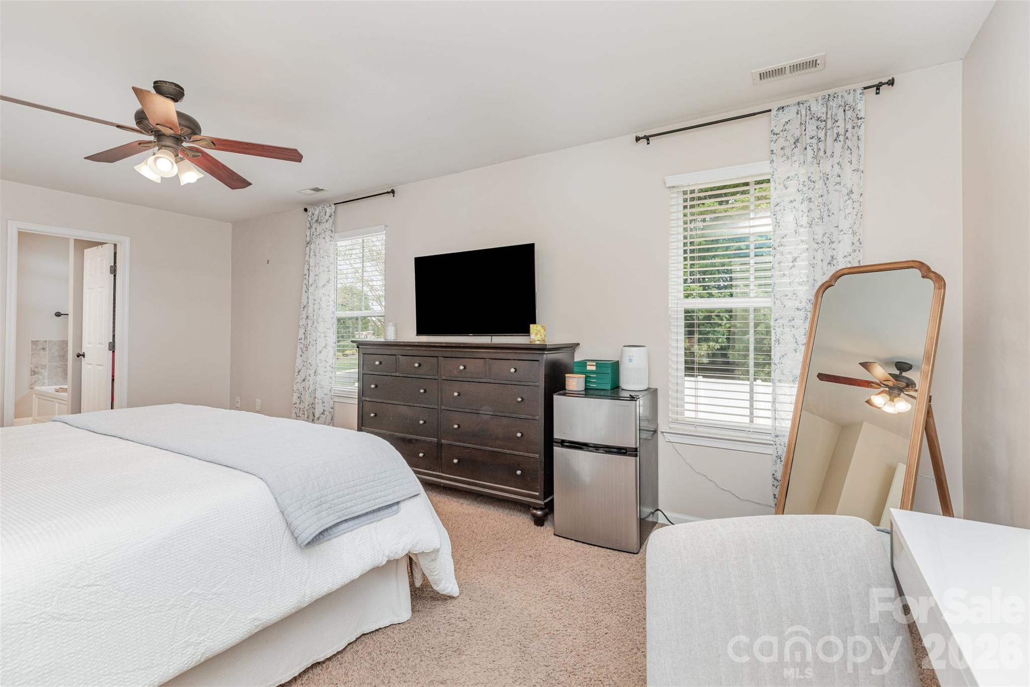 353 Chorus Road Fort Mill, SC 29715 - Photo 22 of 30 a bedroom with a bed and a flat screen tv