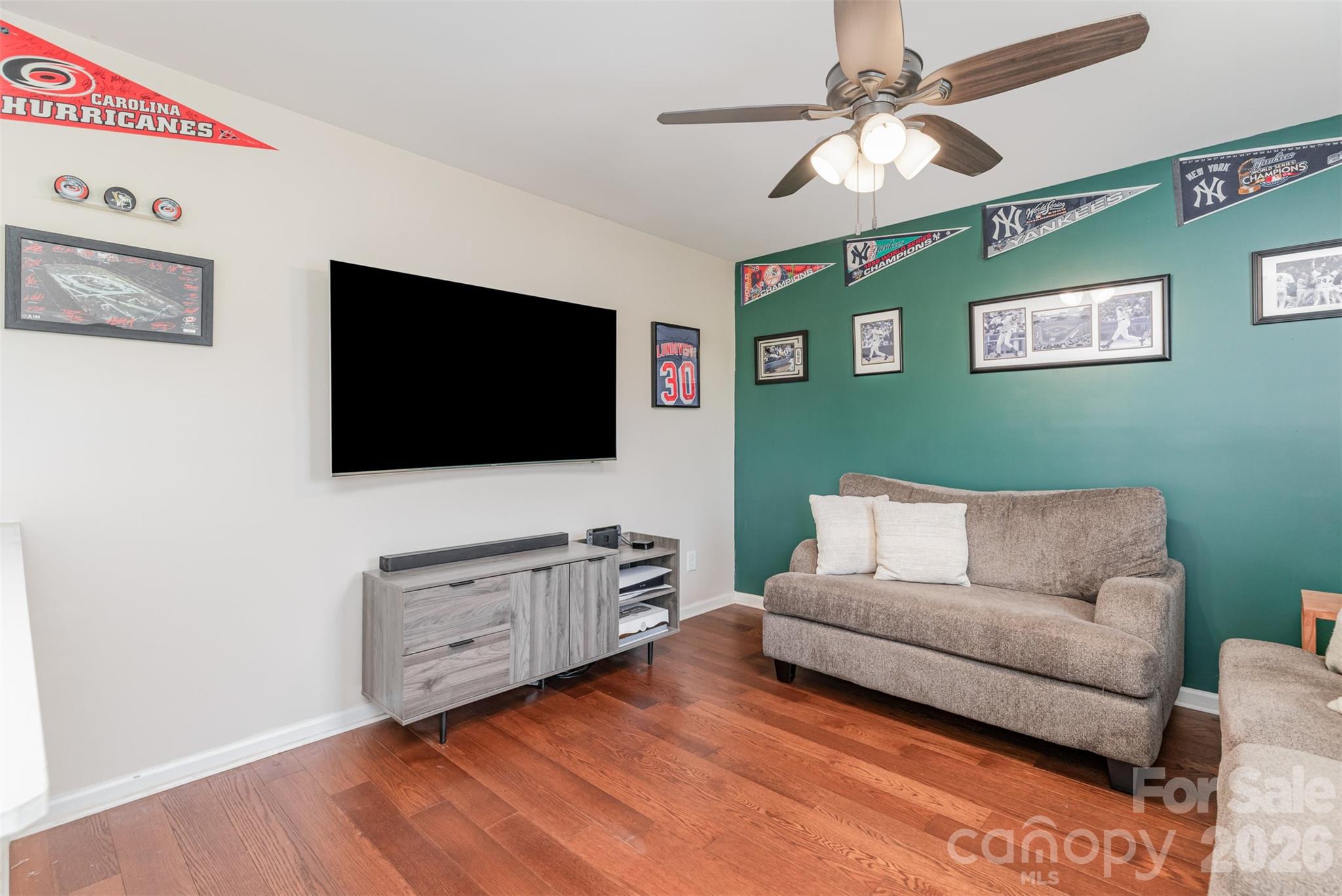 353 Chorus Road Fort Mill, SC 29715 - Photo 5 of 30 a living room with furniture and a flat screen tv