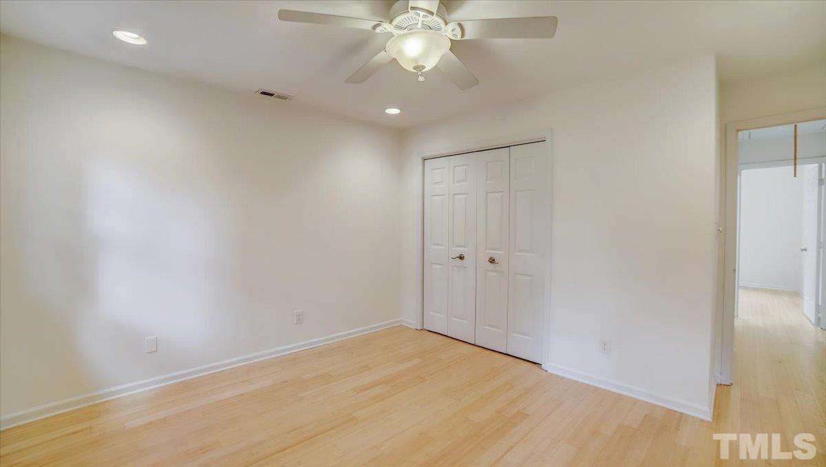 2504 Noble Road Raleigh, NC 27608 - Photo 15 of 28 a view of an empty room and chandelier fan