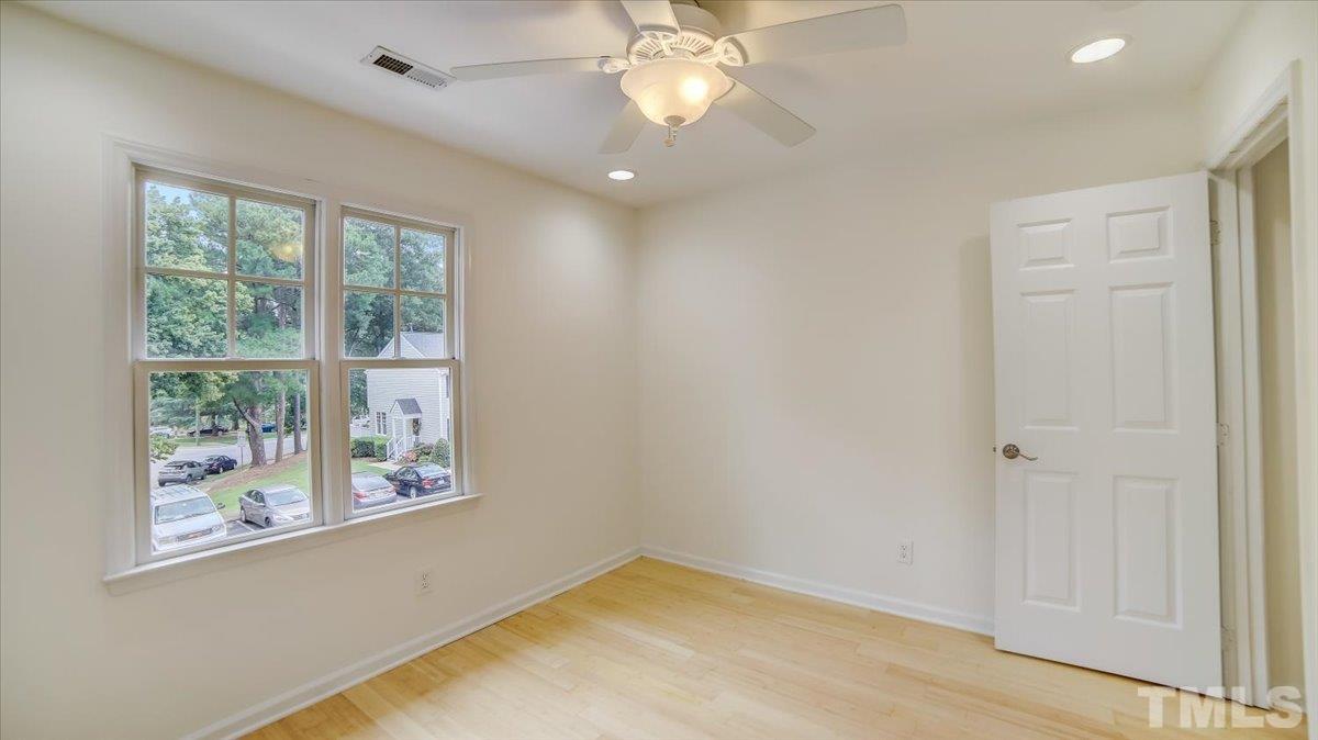 2504 Noble Road Raleigh, NC 27608 - Photo 25 of 28 an empty room with windows and fan