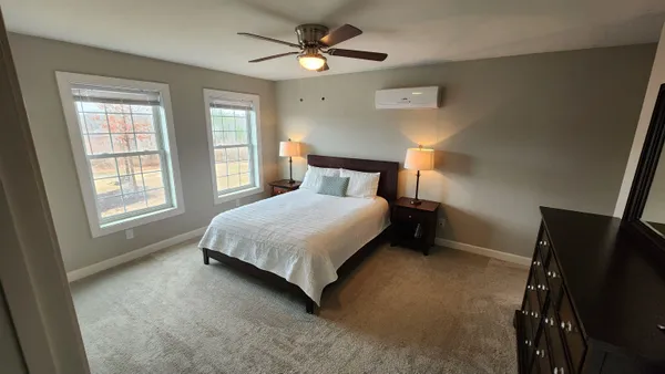 a bedroom with a bed and a closet