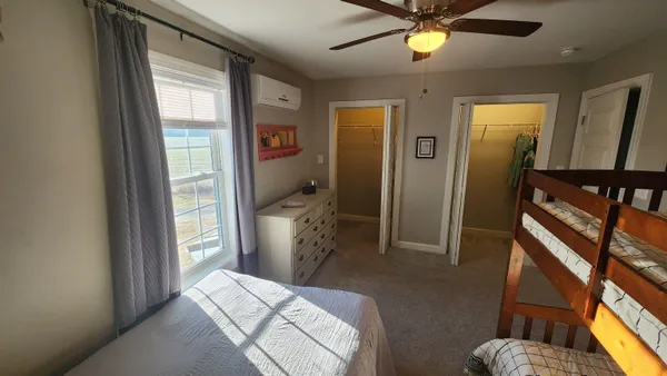 a view of a bedroom from the hallway