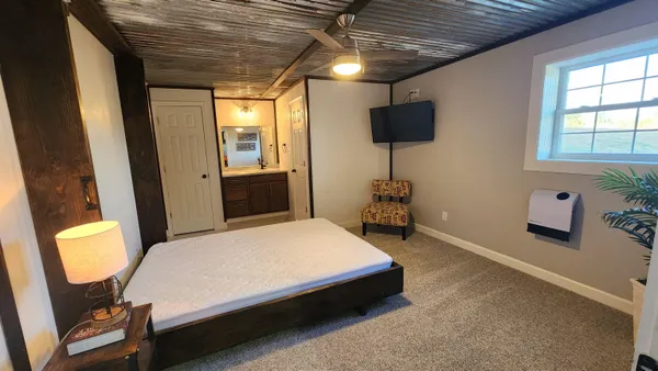a view of a hallway with storage and utility