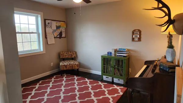 a view of a workspace with furniture