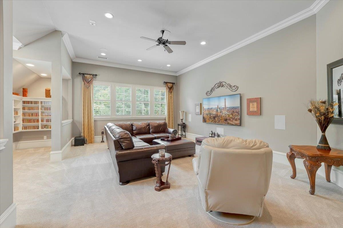 9712 Honeycutt Road Raleigh, NC 27614 - Photo 33 of 83 Surround Sound Mounted Speakers and Built In. Bar Area with Cabinetry, Under Counter Beverage Fridge and Collection Nook for CD's and Records. Bonus Media Room