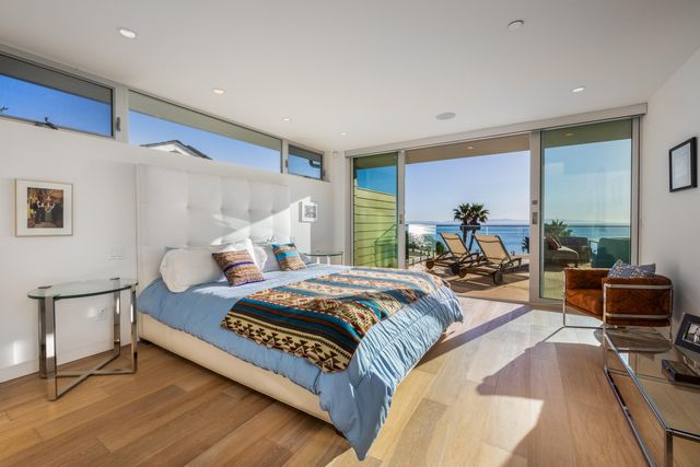 a bedroom with bed and a table