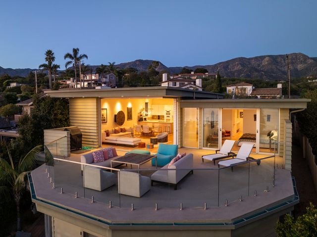 a view of swimming pool with outdoor seating