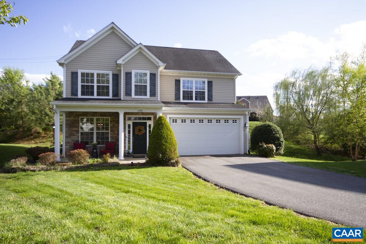 1380 Amber Ridge Road Charlottesville, VA 22901 - Photo 1 of 35 a front view of a house with a yard and garage