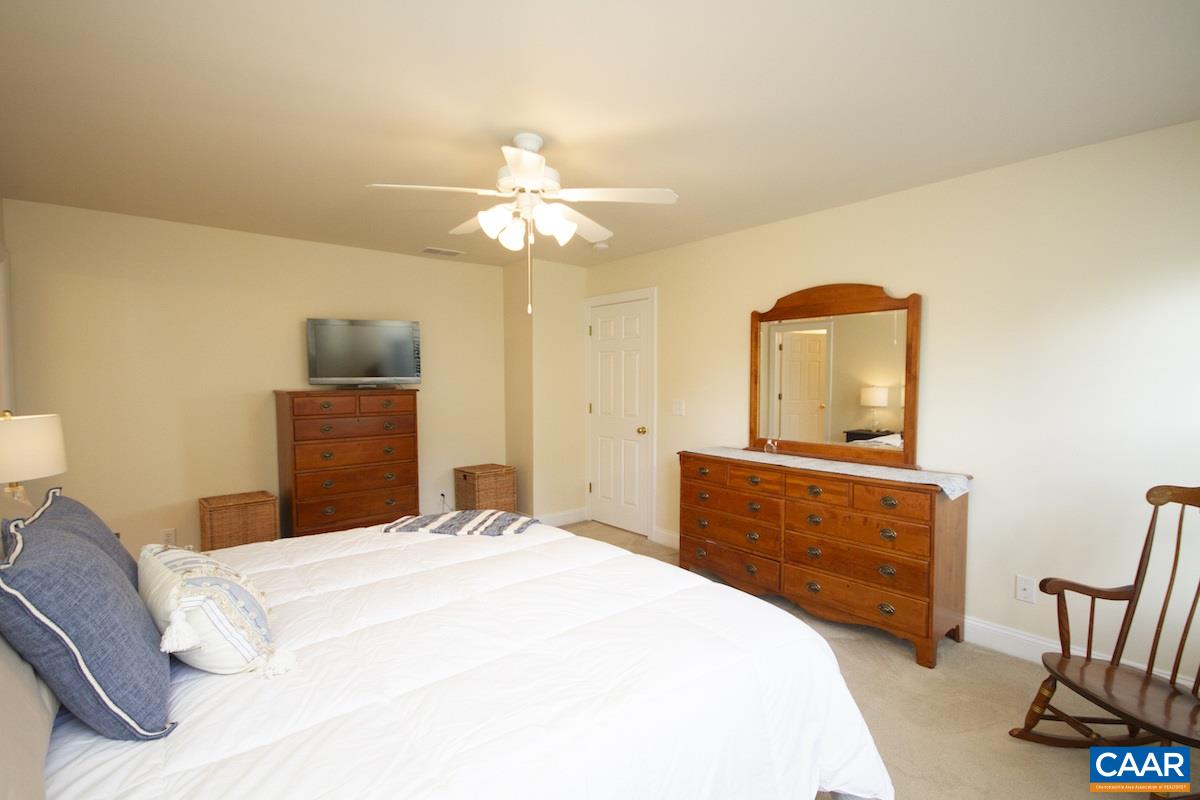1380 Amber Ridge Road Charlottesville, VA 22901 - Photo 17 of 35 a bedroom with a bed and a dresser