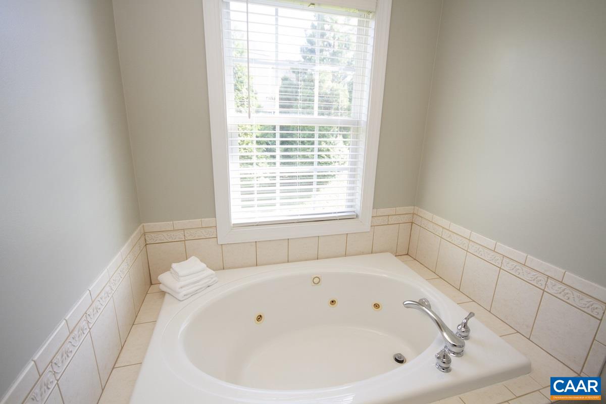 1380 Amber Ridge Road Charlottesville, VA 22901 - Photo 20 of 35 a white bath tub sitting in a bathroom