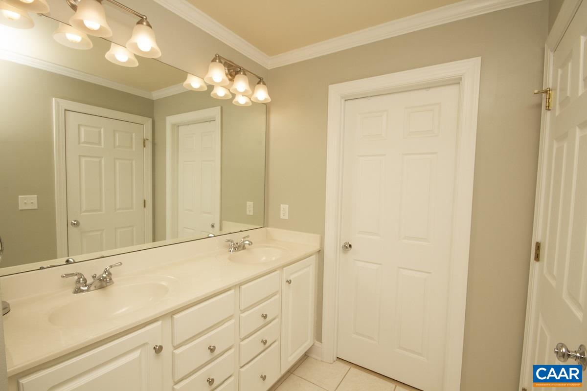 1380 Amber Ridge Road Charlottesville, VA 22901 - Photo 21 of 35 a bathroom with a double vanity sink and a mirror