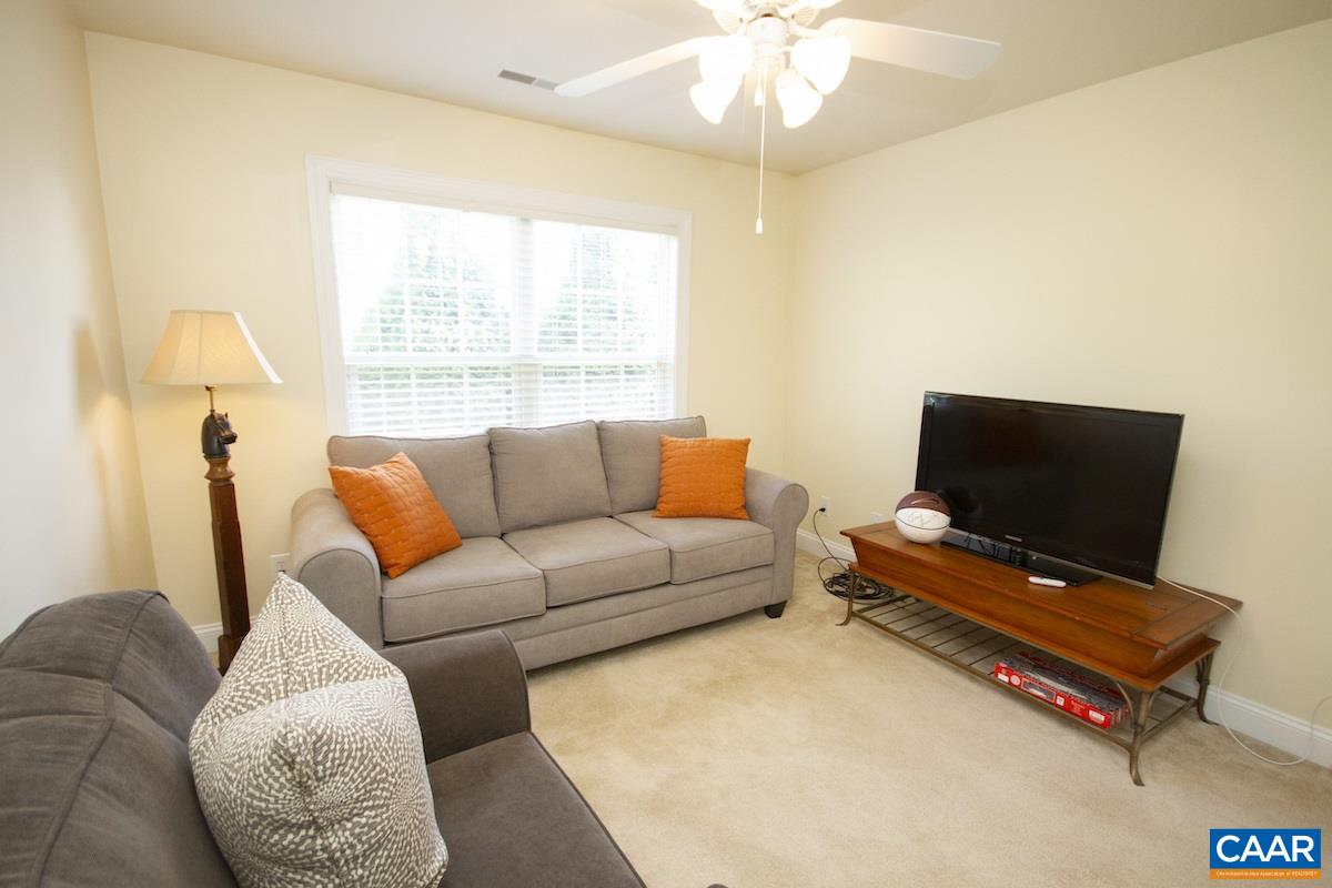 1380 Amber Ridge Road Charlottesville, VA 22901 - Photo 25 of 35 a living room with furniture and a flat screen tv