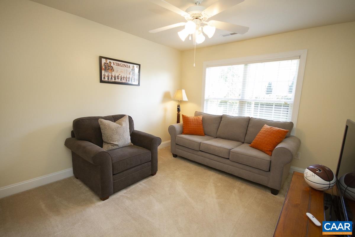 1380 Amber Ridge Road Charlottesville, VA 22901 - Photo 26 of 35 a living room with furniture and a large window