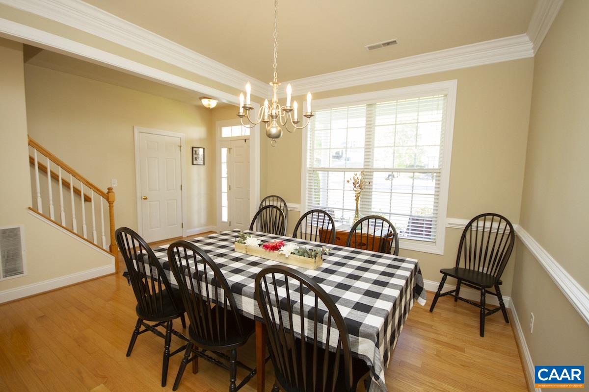 1380 Amber Ridge Road Charlottesville, VA 22901 - Photo 6 of 35 a view of a a dining room with furniture window and wooden floor