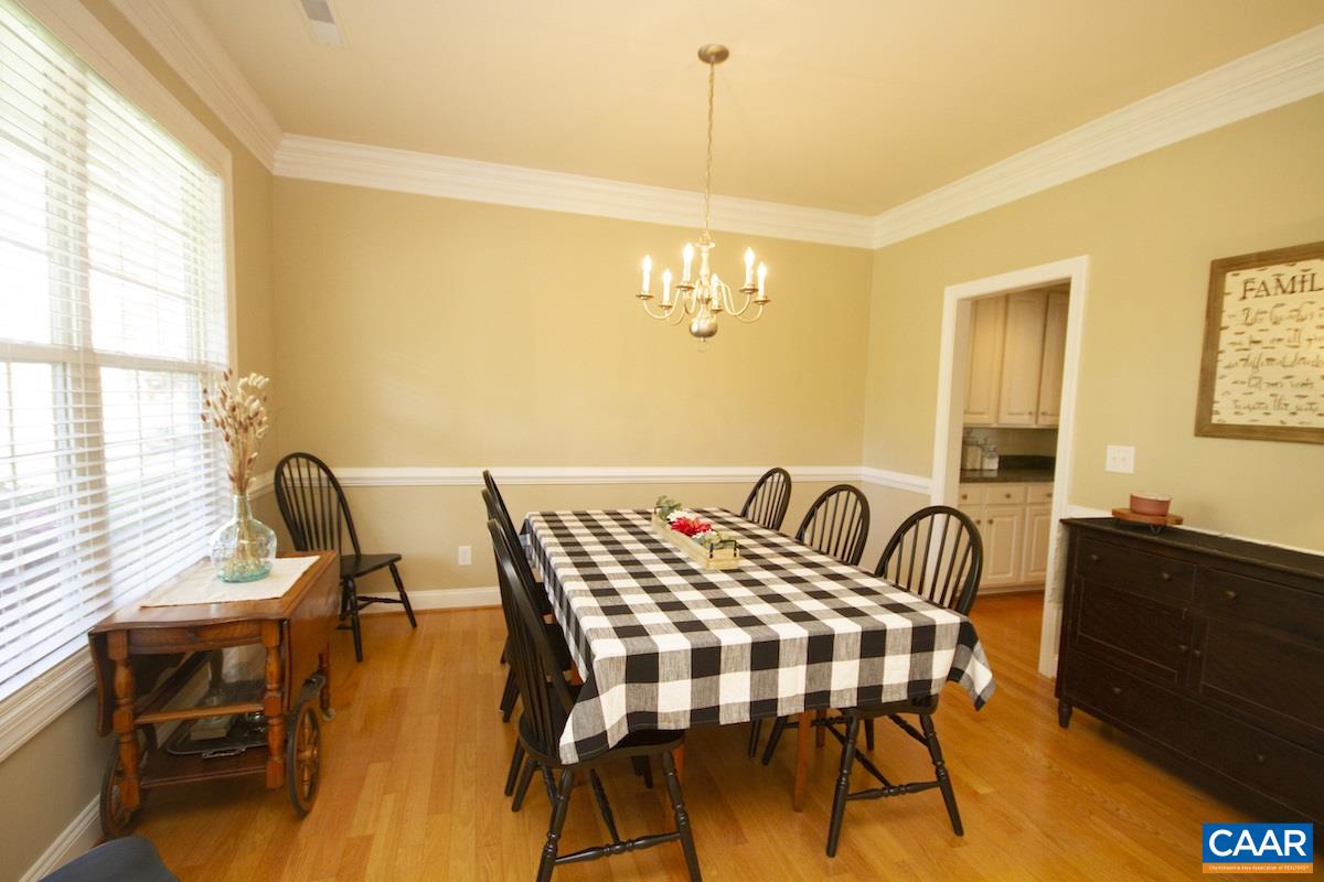 1380 Amber Ridge Road Charlottesville, VA 22901 - Photo 7 of 35 a view of a dining room with furniture and wooden floor