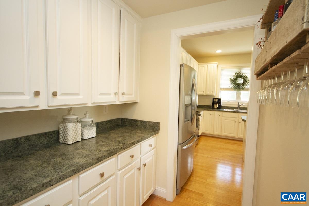 1380 Amber Ridge Road Charlottesville, VA 22901 - Photo 9 of 35 a kitchen with granite countertop a sink a stove and refrigerator