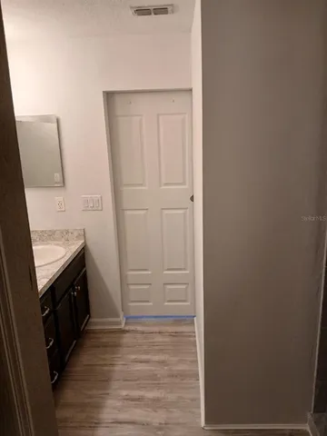 a view of a bathroom from the hallway