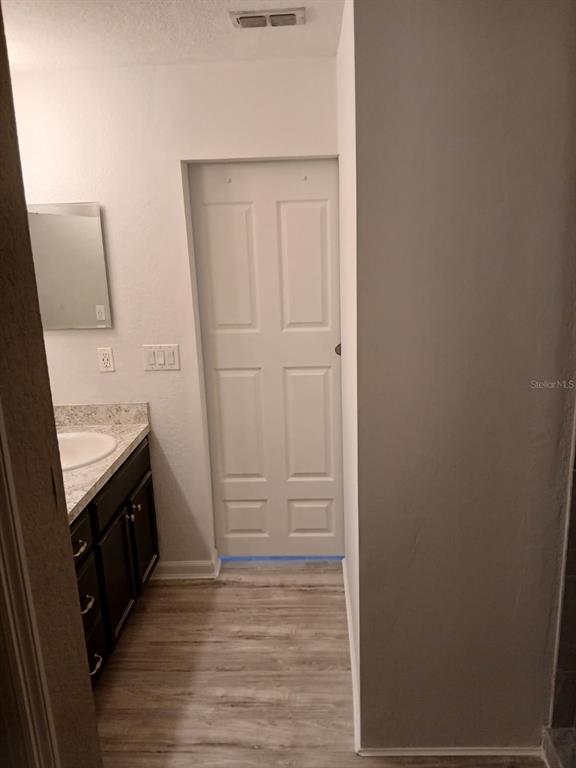 Undisclosed Address St. Cloud, FL 34772 - Photo 3 of 6 a view of a bathroom from the hallway