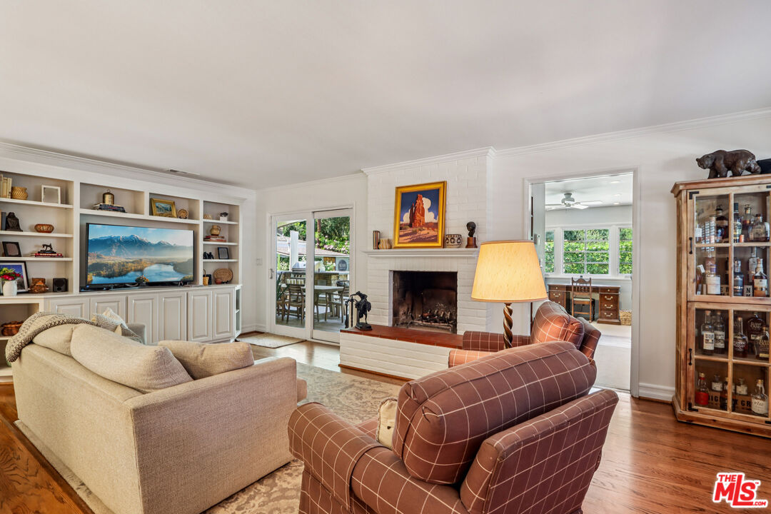 875 Hugo Reid Drive Arcadia, CA 91007 - Photo 11 of 53 a living room with furniture and a fireplace