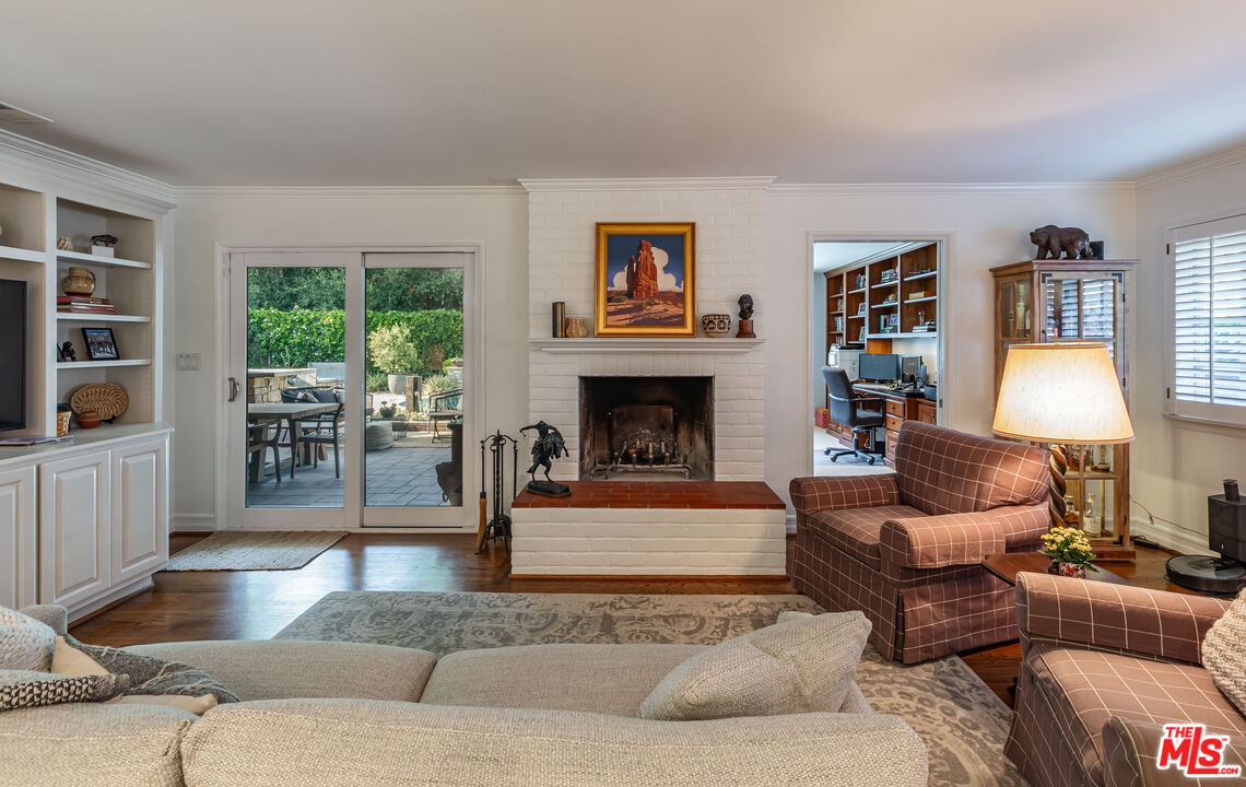 875 Hugo Reid Drive Arcadia, CA 91007 - Photo 12 of 53 a living room with furniture and a fireplace