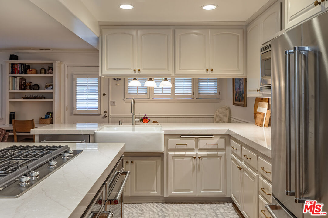 875 Hugo Reid Drive Arcadia, CA 91007 - Photo 15 of 53 a kitchen with cabinets appliances and a window