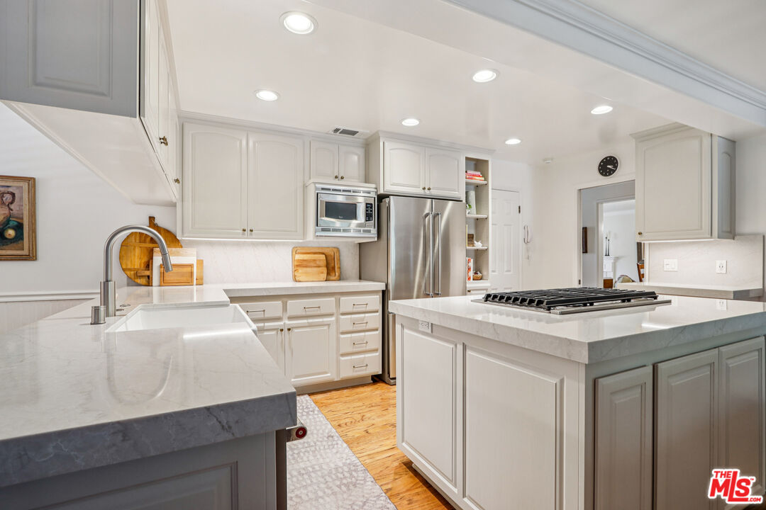 875 Hugo Reid Drive Arcadia, CA 91007 - Photo 16 of 53 a kitchen with a sink stove and refrigerator