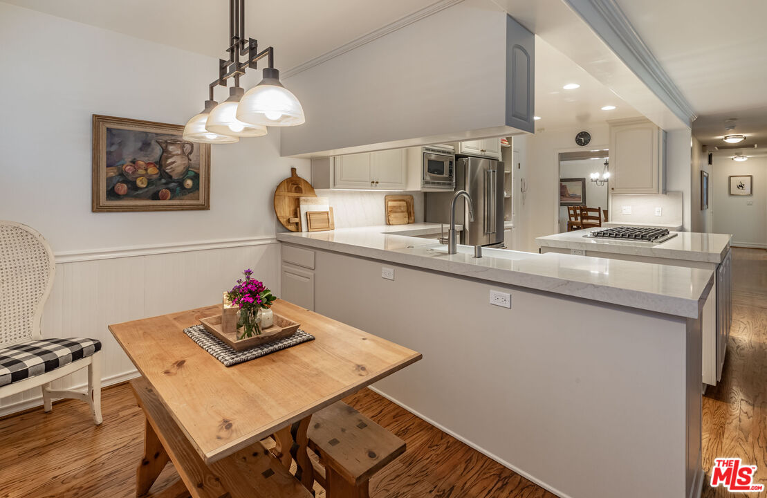 875 Hugo Reid Drive Arcadia, CA 91007 - Photo 17 of 53 a view of a dining room with furniture and wooden floor