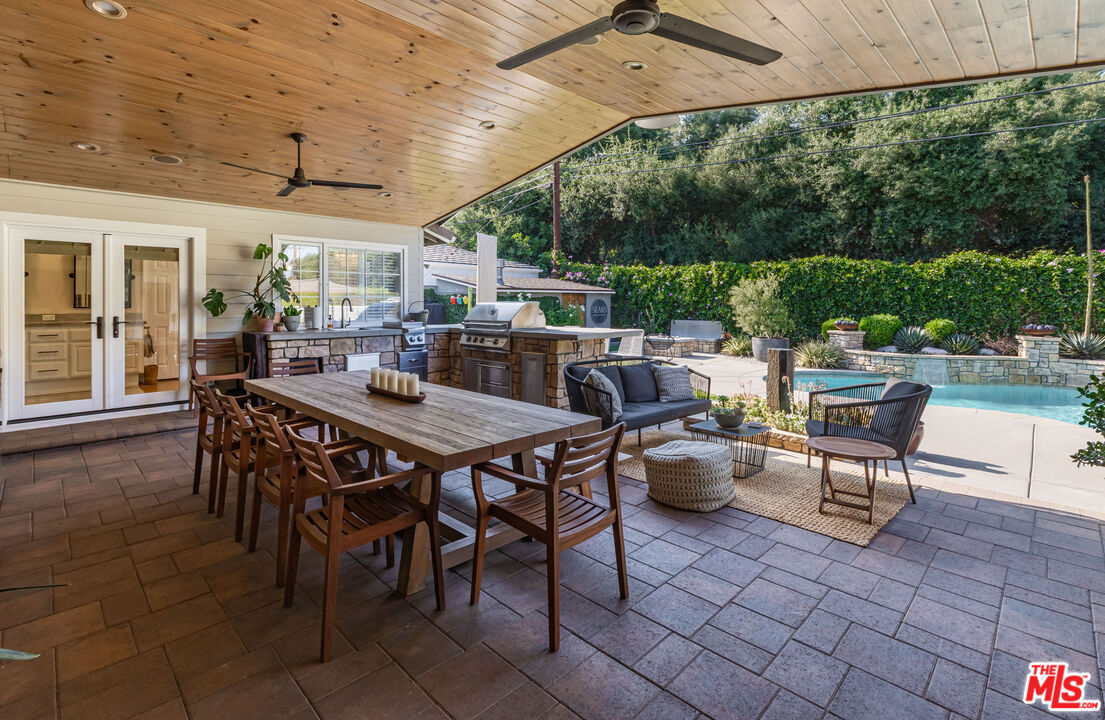 875 Hugo Reid Drive Arcadia, CA 91007 - Photo 31 of 53 a view of a patio with a dining table and chairs