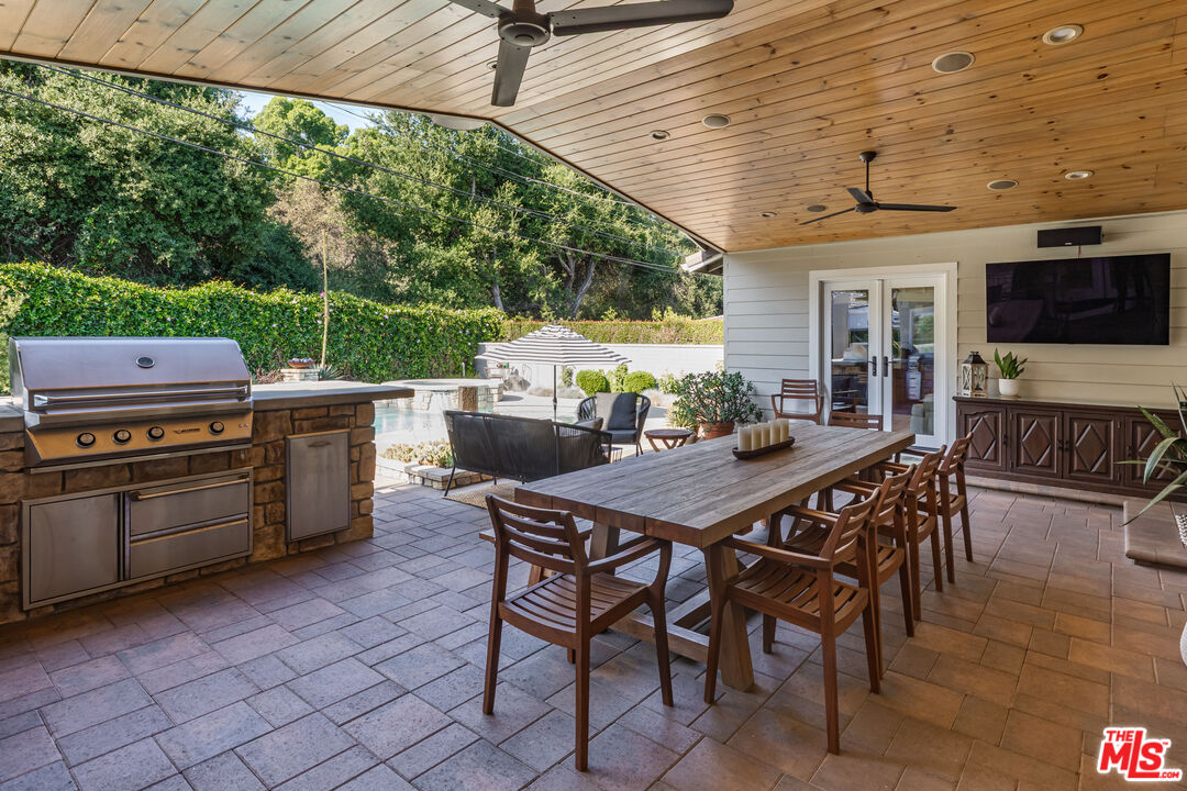 875 Hugo Reid Drive Arcadia, CA 91007 - Photo 32 of 53 a view of a patio with a table and chairs